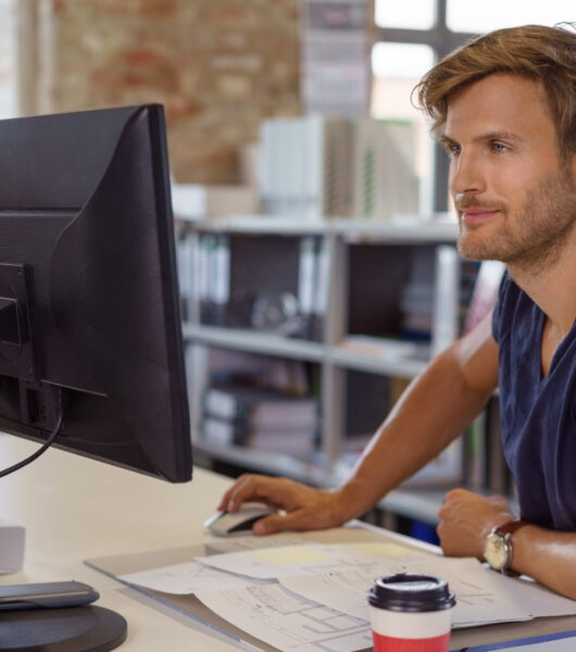 Businessman,Uses,Computer,Mouse,As,He,Works,In,His,Office